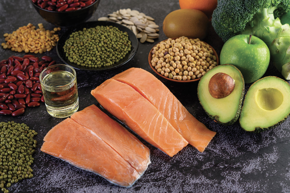 legumes-broccoli-fruit-salmon-placed-black-cement-floor